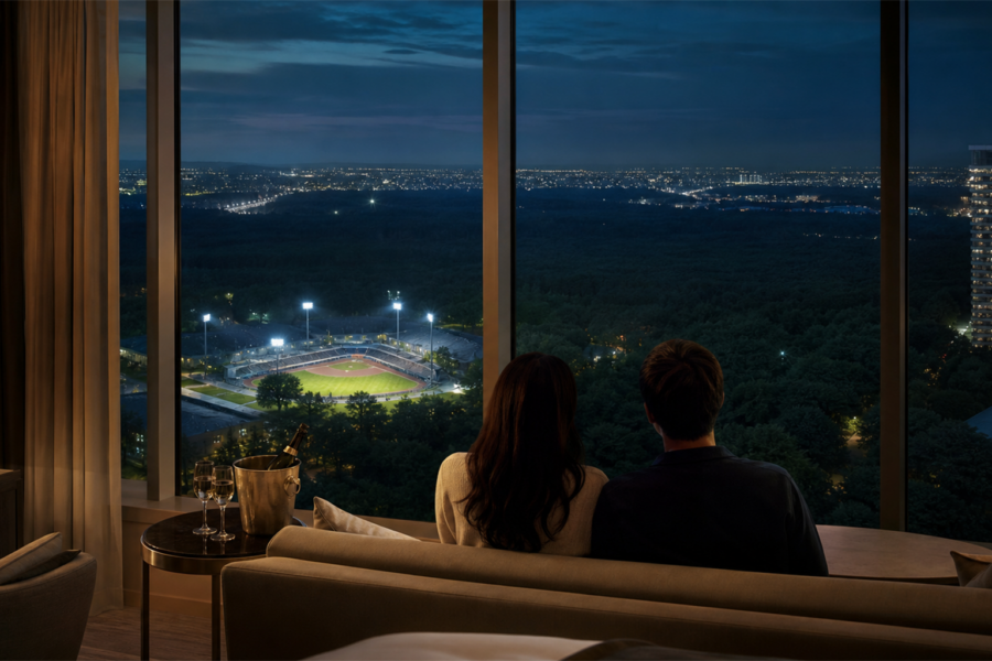 A calm, upscale image evoking the afterglow of a concert trip, overlooking a Hokkaido ballpark at night