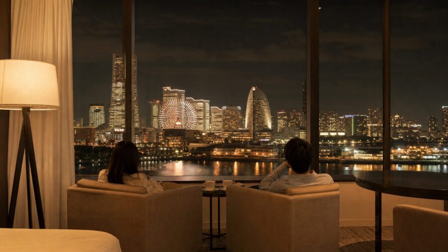 A calm, upscale image evoking the afterglow of a concert trip, overlooking the Minato Mirai night skyline